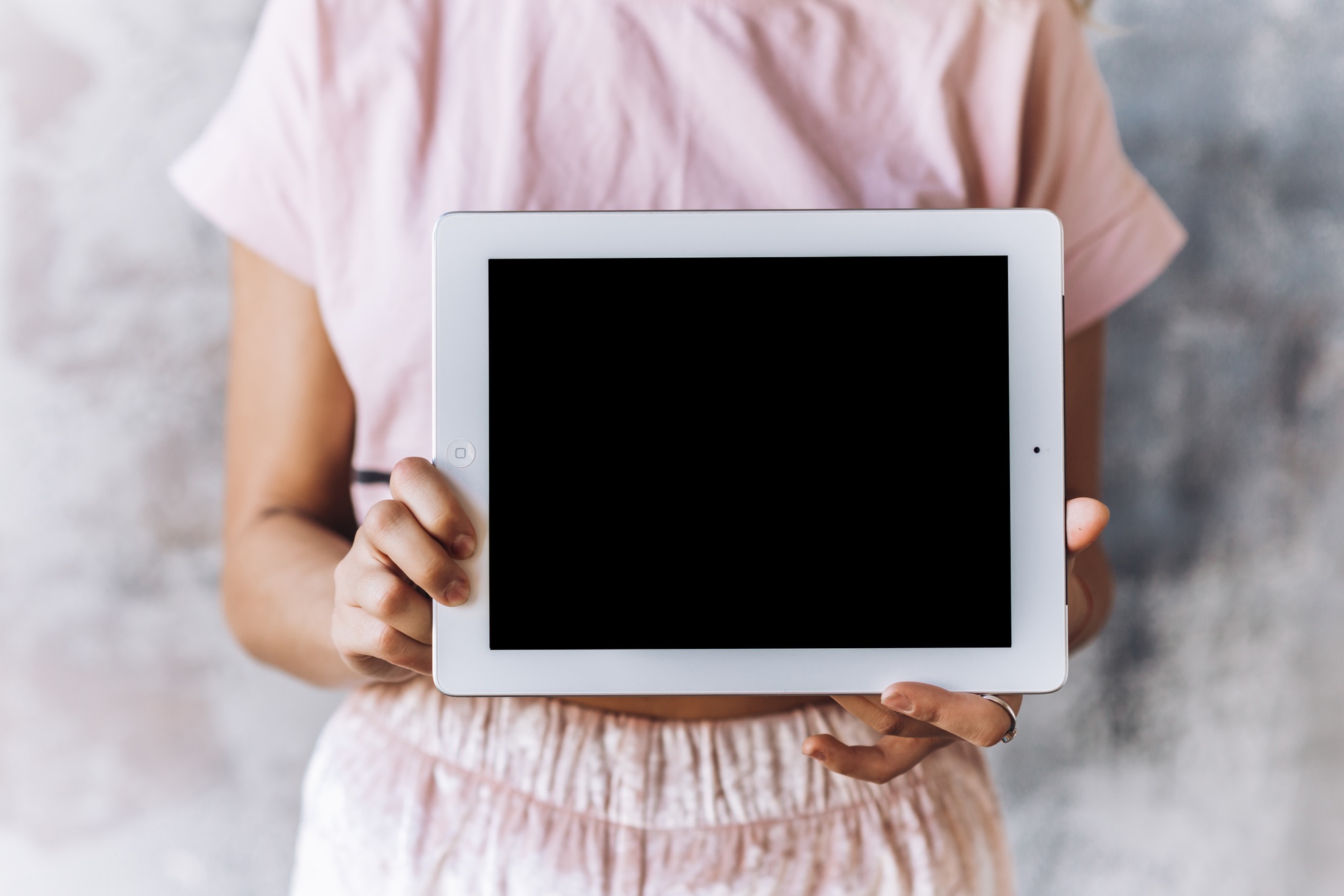 Closeup of tablet in the center in female hands
