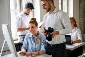 Creative startup young multiethnic business people working together at designer agency in office