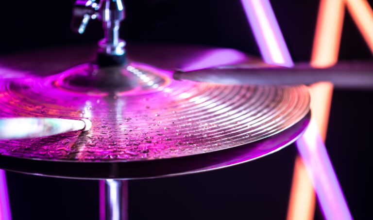 Hi-hat close-up of plates with drumsticks