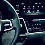 Close-up view of a luxury car's dashboard featuring a modern touchscreen display and advanced features.