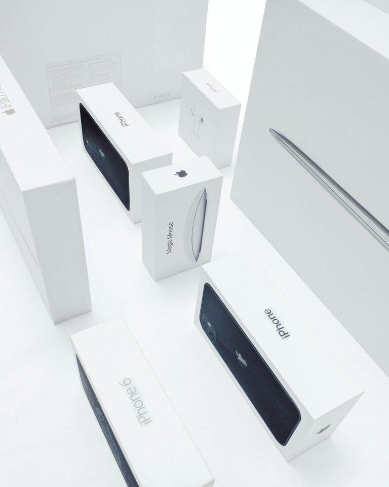 Aerial view of various Apple product boxes showcasing sleek design and branding.