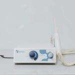 A high-tech ozone therapy device with a minimalistic design on a white background.