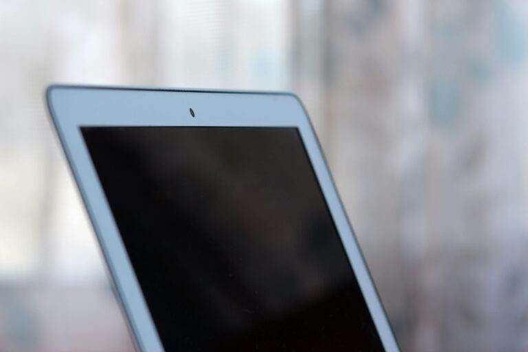 Close-up shot of a tablet with a blank screen, ideal for mockups.