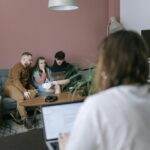 A diverse group of young adults collaborating in a modern office.