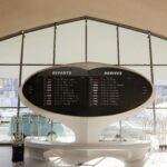 Futuristic departure and arrival board at JFK Terminal in New York City, USA.