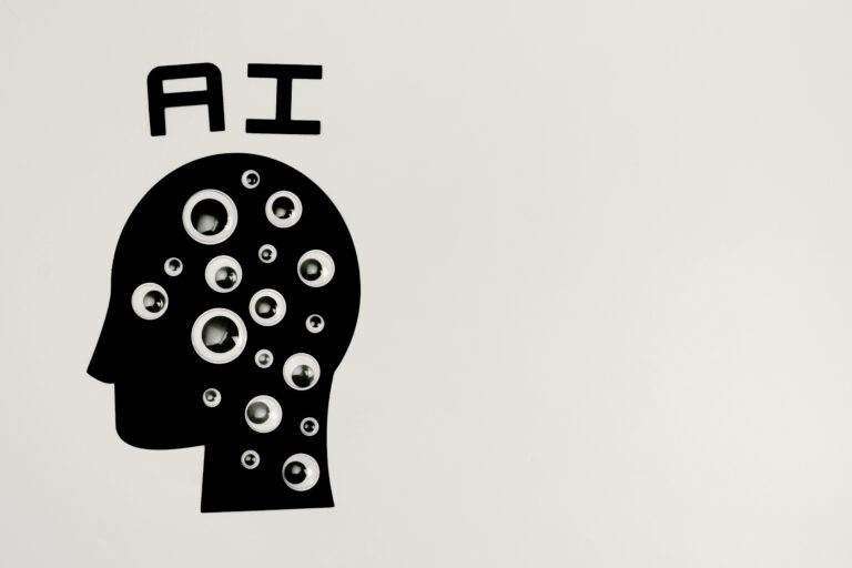 ChatGPT : l’IA qui redéfinit notre rapport à la technologie Abstract illustration of AI with silhouette head full of eyes, symbolizing observation and technology.