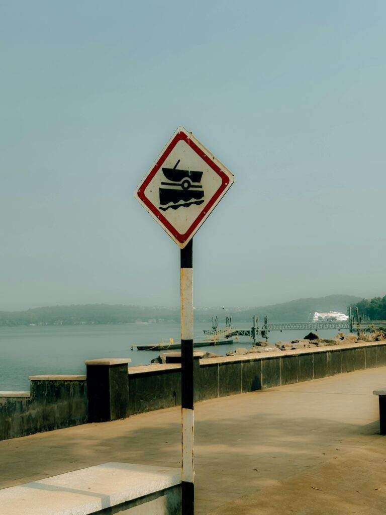 A road sign warning about vehicles near water in Panaji, Goa, India.