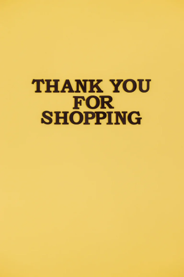 Bold black text 'Thank You for Shopping' on a vibrant yellow background, offering clear copyspace.