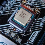 Detailed view of an Intel i7 processor installed on a computer motherboard.