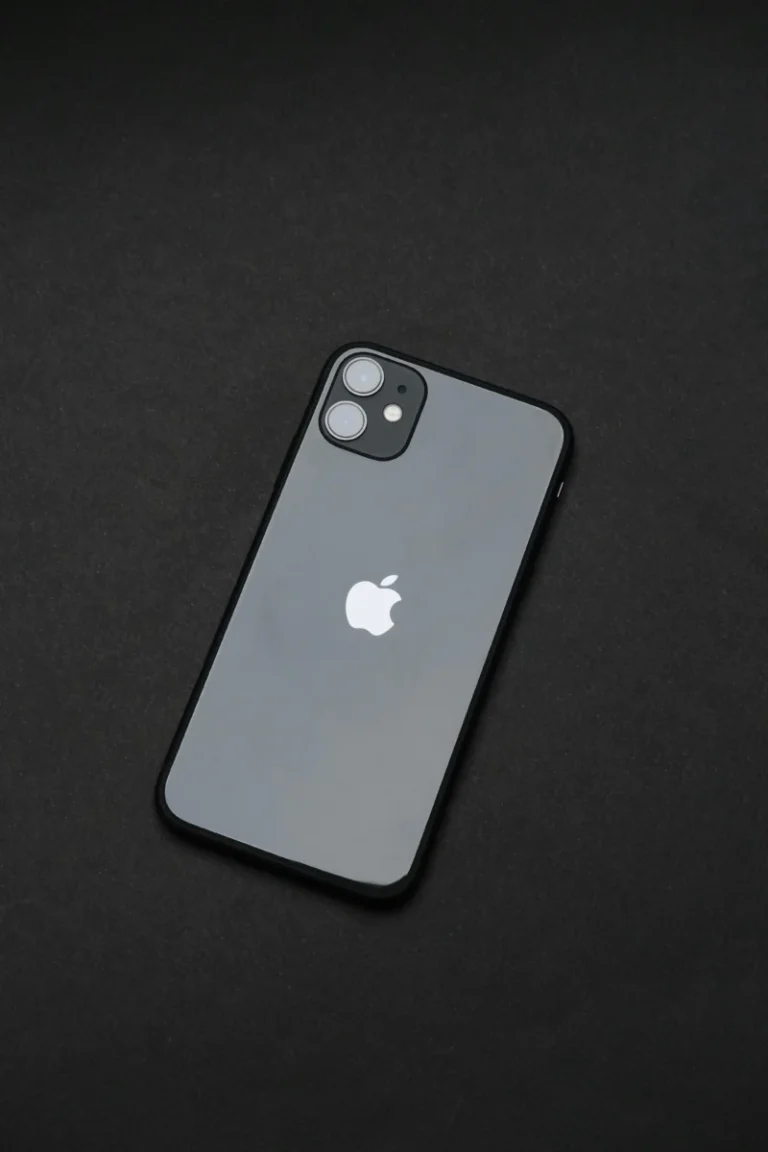 An elegant smartphone on a dark background, emphasizing modern tech design.