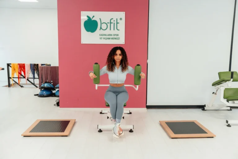 A woman exercising at B-Fit gym in Yalova, Türkiye, focused on fitness and health.