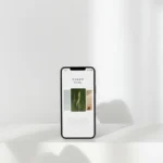 A sleek smartphone displaying artwork in a minimalist setting, perfect for tech and design themes.