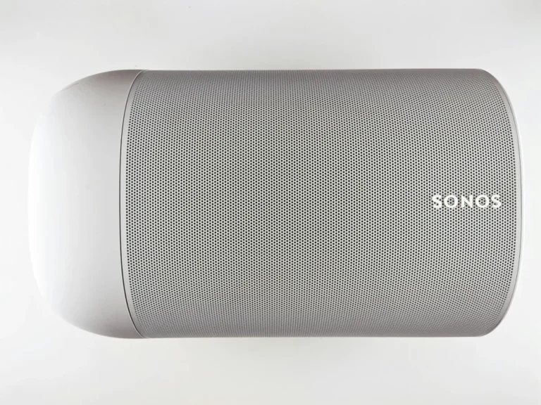 Top view of a sleek wireless speaker with a minimalistic design.