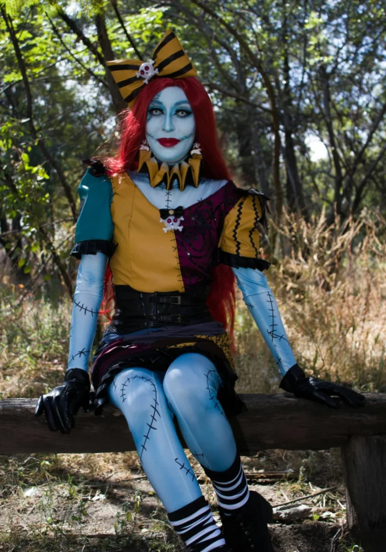 A colorful cosplay costume inspired by a Tim Burton character photographed in a natural outdoor setting.