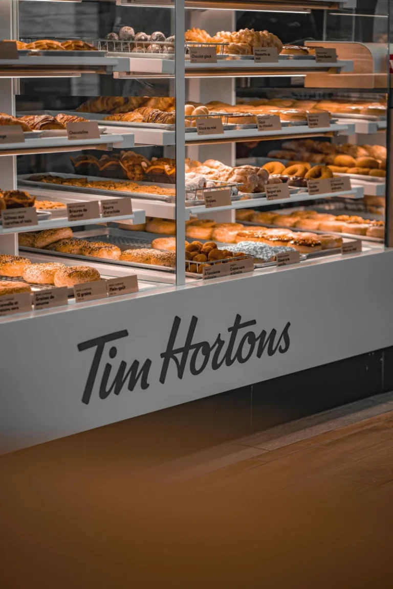 A showcase of fresh pastries and baked goods at Tim Hortons in Québec, Canada.