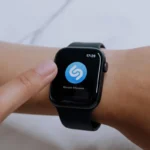 A close-up view of a smartwatch displaying the Shazam app, highlighting modern technology.