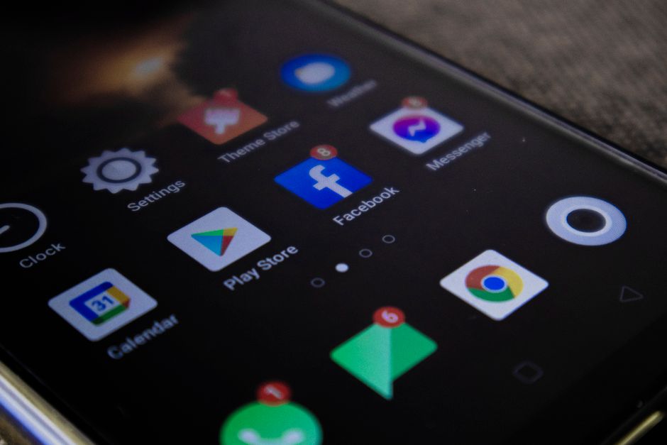 Detailed view of a smartphone screen with popular app icons including Facebook and Messenger.