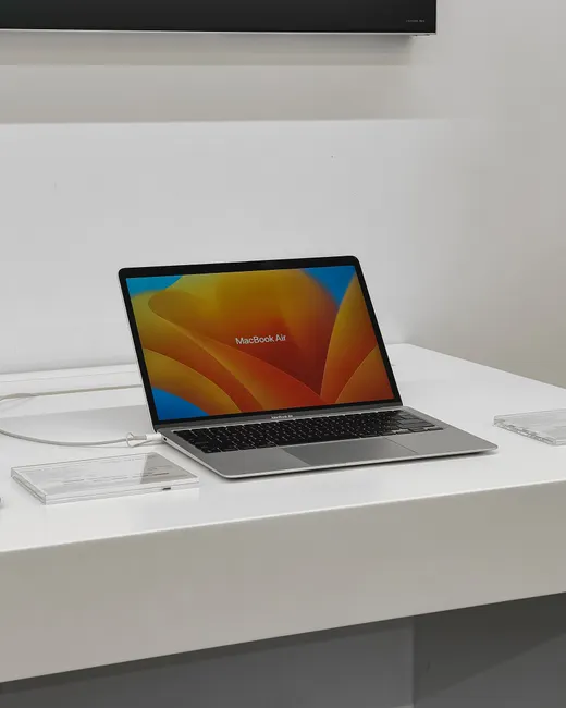 Minimalistic display of a MacBook Air in an electronics store, Kolkata, India.