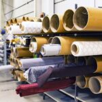 Foxconn investit 174 millions au Kentucky, sans lien officiel avec Apple Rows of textile rolls stored in a factory for industrial manufacturing.