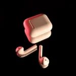 AirPods Pro 2 : 86,5 % des seuils à 10 dB près, sans miracle White wireless earbuds with a charging case, highlighted with red lighting on a reflective black surface.