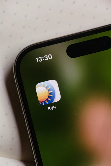 A close view of a weather app icon on a smartphone screen.