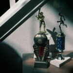 Apple TV décroche six nominations aux ACE Awards, dont F1, verdict le 27 février 2026 A collection of soccer and baseball trophies displayed indoors, capturing childhood nostalgia.