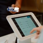 A modern cashless payment system using a tablet and card for seamless transactions.