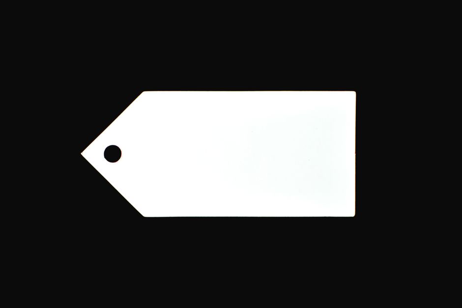 A white blank price tag against a black background, perfect for commercial use.