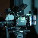 Close-up of a professional ARRI video camera rig set up for filming indoors.