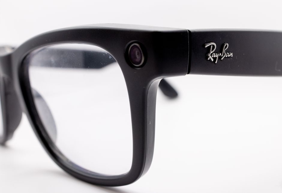 Detailed close-up shot of black smart glasses featuring a built-in camera, highlighting modern technology and design.