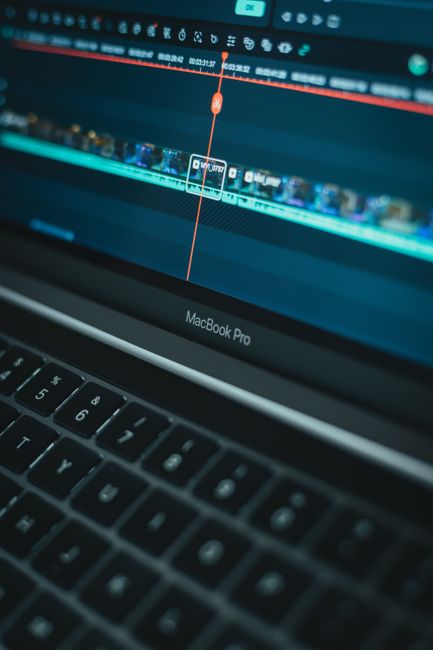 Detailed view of video editing software on a MacBook Pro laptop computer.