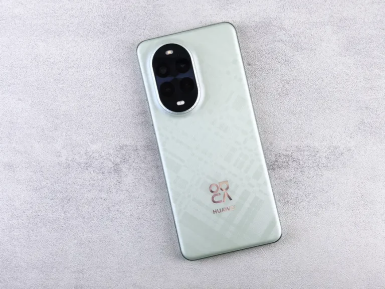 Modern smartphone with quad-camera setup displayed on a textured background for tech enthusiasts.