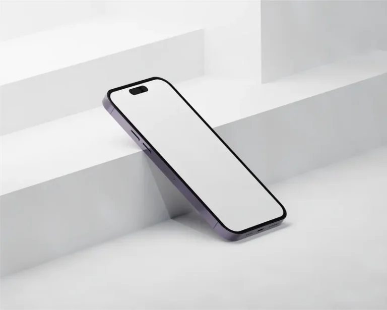 iPhone 17e : production après le CES 2026, février possible Sleek smartphone with blank screen leaning on minimalist white steps, ideal for technology themes.